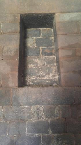 Pumamarca Hacienda Inca niche with coca leaves. Photo by Camille Sauvé